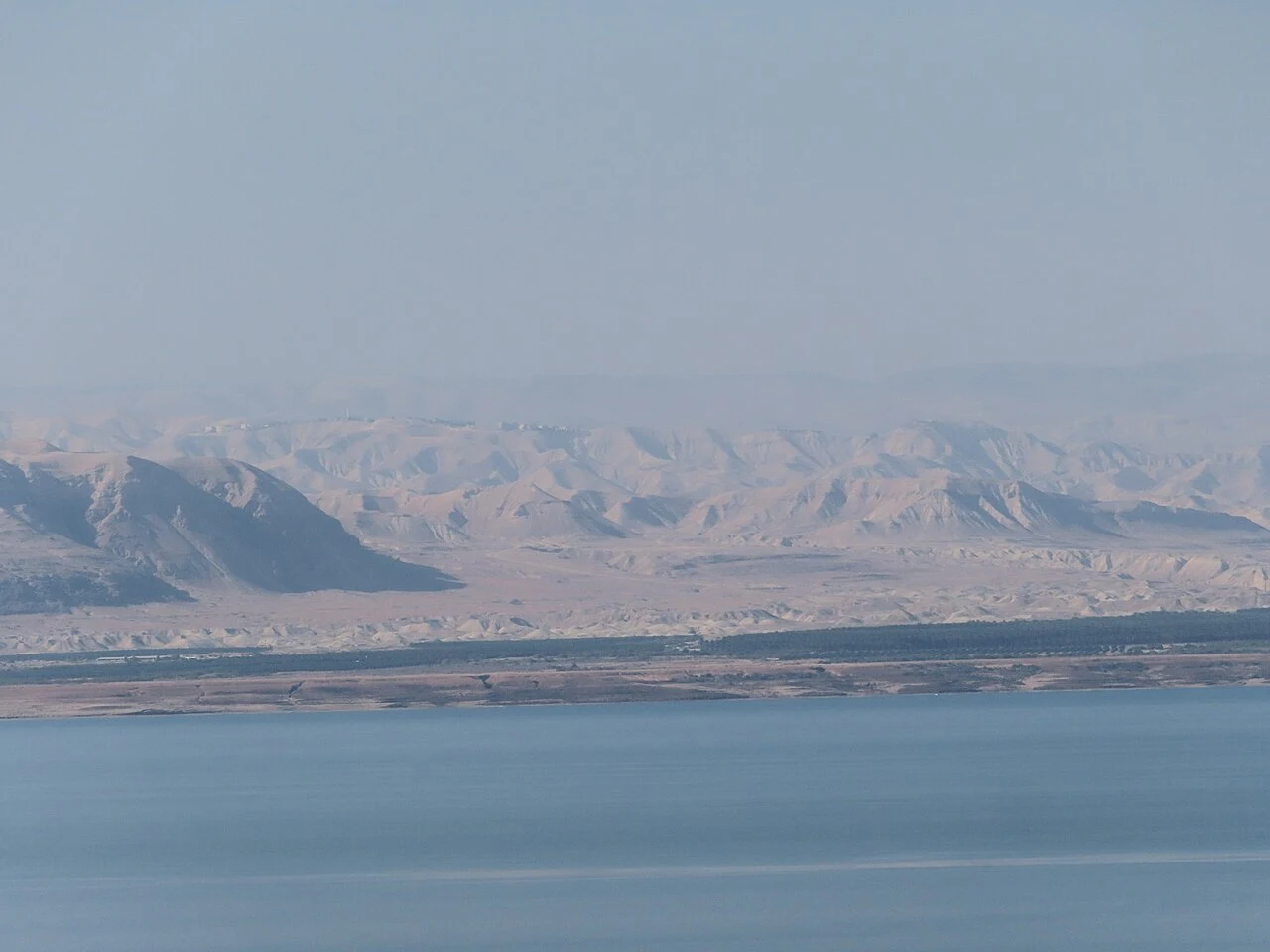 Water and distant mountains across the Dead Sea seen from Jordan